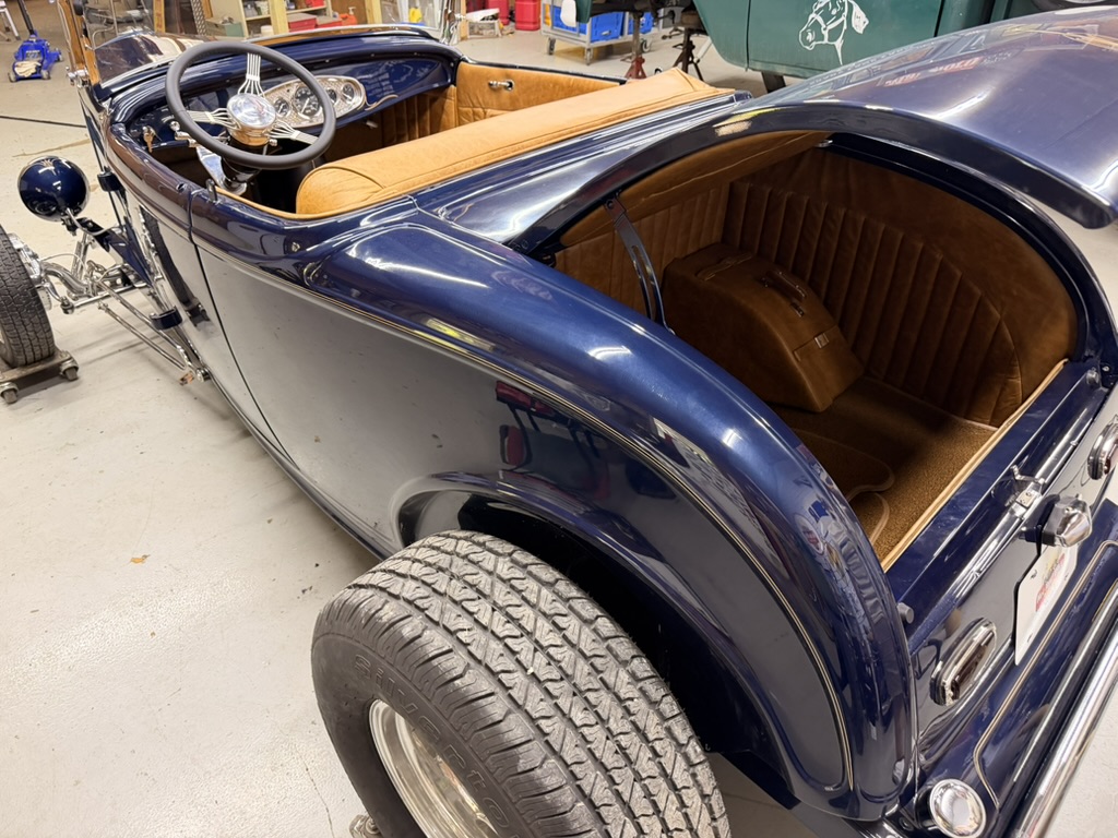 Custom leather cockpit and matching leather-lined trunk