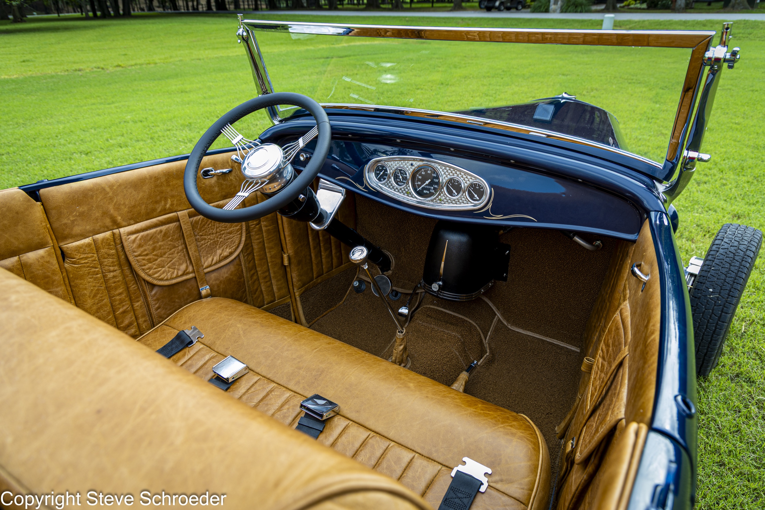 Custom tan leather cockpit and engine-turned dashboard
