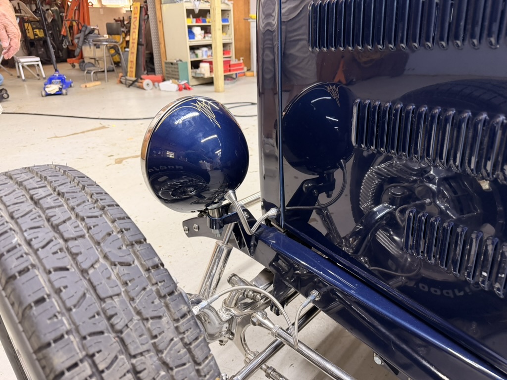 Headlight, front tire and polished suspension details