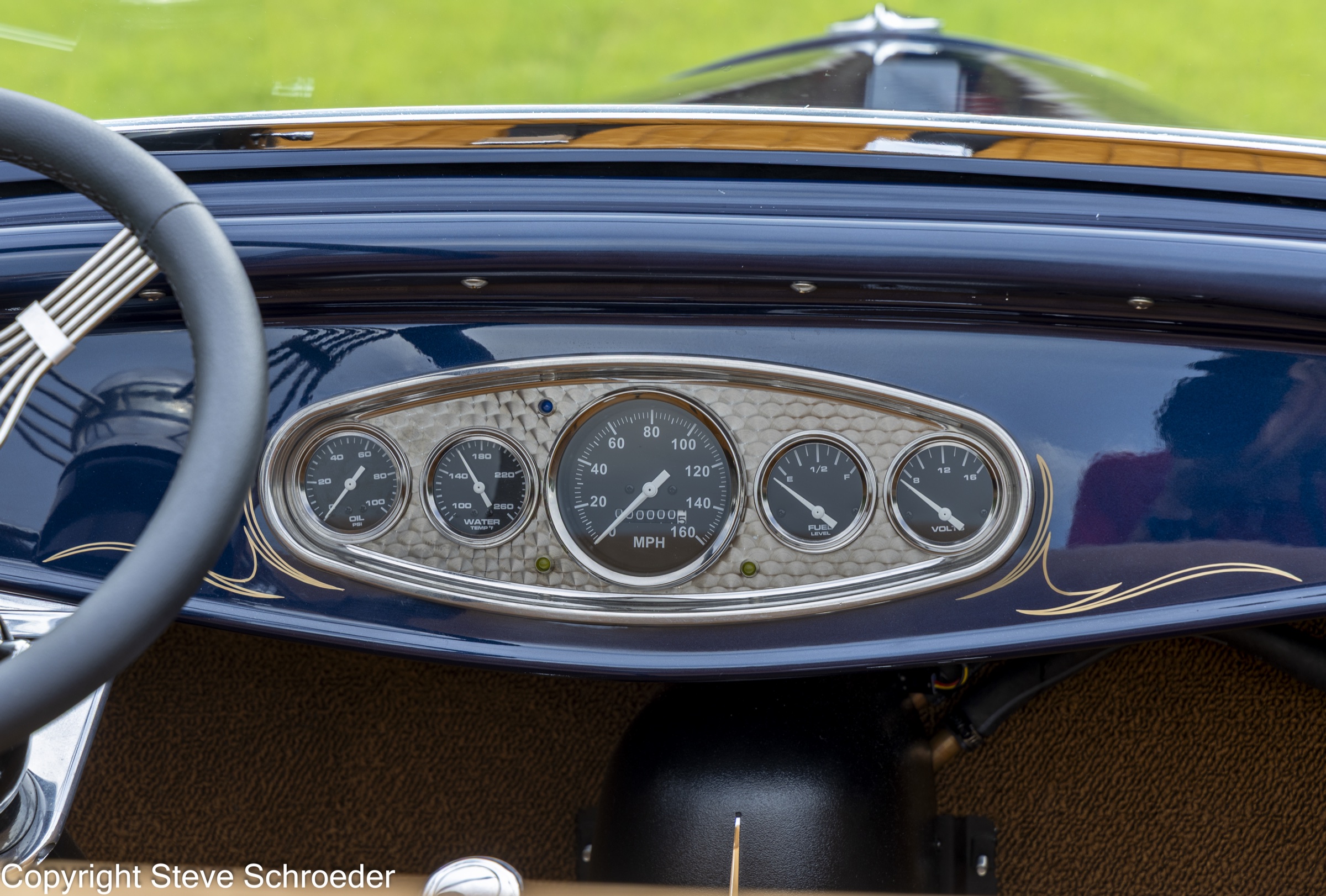 Classic gauges set in an engine-turned instrument panel